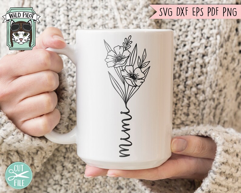 May include: White ceramic mug with a black outline of flowers and the word "mum" in a cursive script.