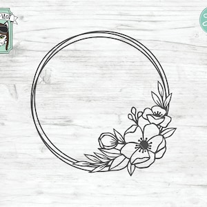 May include: A black and white line drawing of a circular wreath with a floral design. The wreath is empty and has a simple, elegant design. The flowers are stylized and have a delicate look.