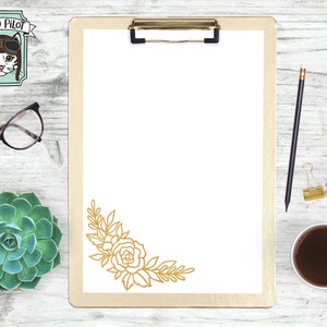 May include: A clipboard with a white background and a gold floral design in the bottom right corner. The clipboard is on a white wooden surface with a succulent plant, a pair of glasses, a pencil, a cup of coffee, and five pink circles with the words "svg", "dxf", "eps", "pdf", and "png" written in black.