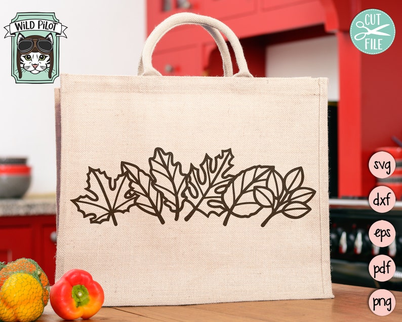 May include: A beige tote bag with a brown outline of autumn leaves printed on the front. The bag is made of burlap and has a brown leather handle.