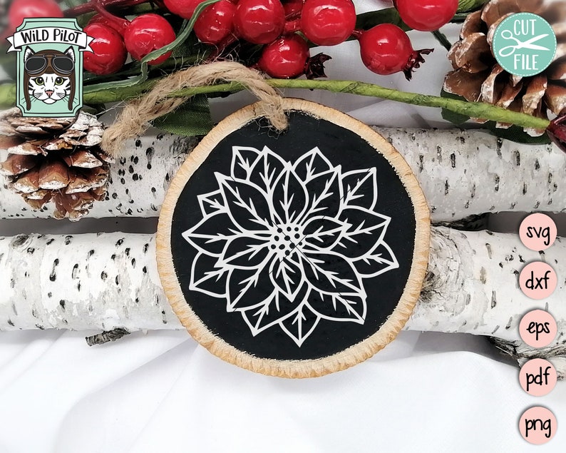May include: A black and white poinsettia flower design on a round wooden ornament. The ornament is ideal for Christmas decorations.