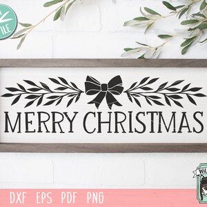 May include: Black and white silhouette of a Christmas wreath with a bow and the text "Merry Christmas".