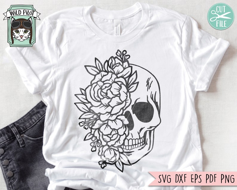 May include: A black and white illustration of a skull with flowers covering one side of the skull. The skull is outlined in black and the flowers are detailed with intricate lines.