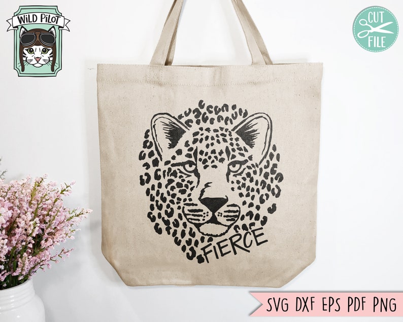 May include: A beige tote bag with a black and white leopard print design and the word "FIERCE" printed below.