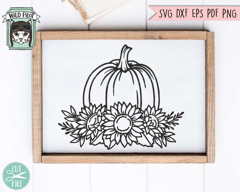 May include: Black and white line art design of a pumpkin with sunflowers around it. The design is on a white background and is framed in a wooden frame.