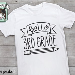 May include: White t-shirt with black text that says "Hello 3rd Grade" with a pencil graphic. The text is in a handwritten style.