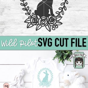 May include: A digital cut file featuring a silhouette of a bunny rabbit sitting in a wreath of leaves and flowers. The design is perfect for creating personalized crafts, home decor, and apparel.