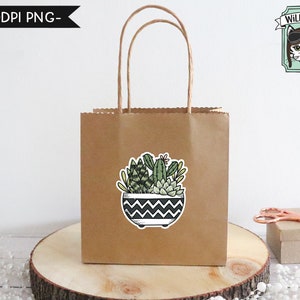May include: A brown paper gift bag with a sticker of a potted succulent plant. The sticker has a black and white chevron pattern on the pot. The bag has a white handle. The text "Wild Pilot" is in a green banner with a cat wearing aviator goggles.