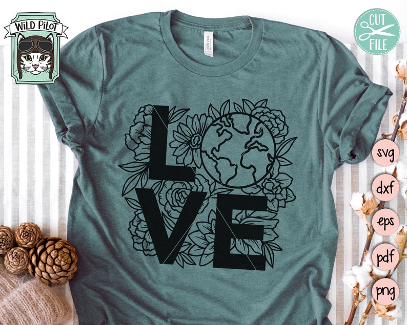 May include: A teal blue t-shirt with a black graphic design of the word "LOVE" with floral elements and a globe in the center.
