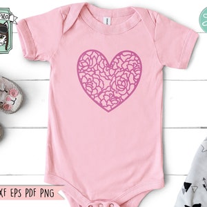 May include: Pink baby onesie with a pink floral heart design.  The onesie has short sleeves and a snap closure.  SVG DXF EPS PDF PNG