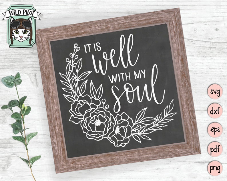 May include: A black chalkboard with a white wooden frame. The chalkboard has a floral design and the text "It is well with my soul".