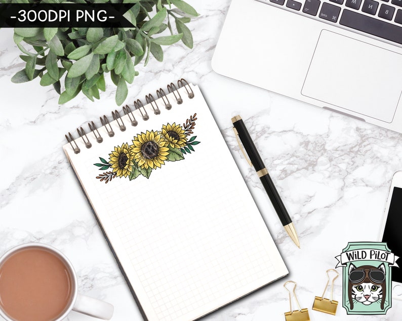 May include: A white notebook with a grid pattern and a spiral binding. The notebook has a drawing of a sunflower bouquet on the front. The bouquet is made up of three sunflowers with brown stems and green leaves. The sunflowers are yellow with brown centers. The notebook is on a white marble surface with a laptop, a pen, and a cup of coffee.