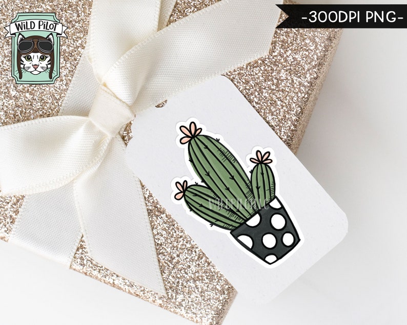 May include: A white gift tag with a black and white polka dot pot with a green cactus plant with pink flowers. The tag is on top of a gold glitter gift box with a white ribbon.