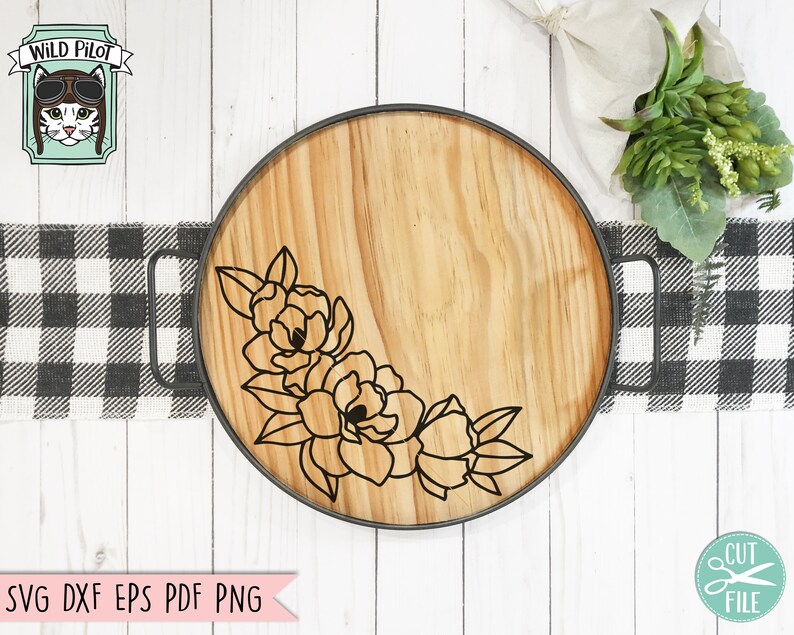 May include: A wooden serving tray with a black metal rim and a floral design. The design features a cluster of stylized flowers in the lower left corner of the tray.