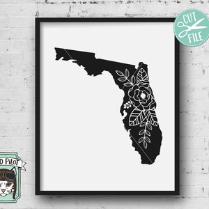 May include: Black and white silhouette of the state of Florida with a floral design on the right side. The floral design is white and features leaves and flowers.