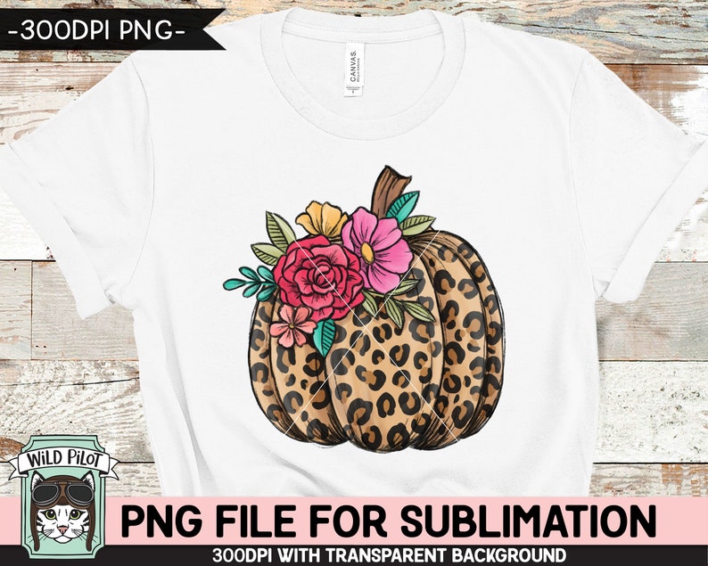 May include: A white t-shirt with a sublimation design of a leopard print pumpkin with pink, orange, and yellow flowers.