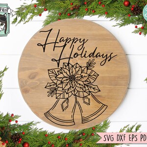 May include: A round wooden sign with the text "Happy Holidays" in cursive script. The sign features a black and white illustration of a poinsettia flower with two bells.