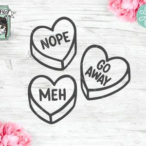 Puede incluir: Tres corazones de conversación en forma de caramelo, en blanco y negro, con las palabras "NOPE", "GO AWAY" y "MEH" en ellos.