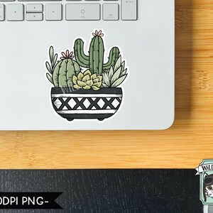 May include: A sticker featuring a black and white pot with a variety of succulents and cacti, including a tall cactus with a pink flower. The pot has a black and white geometric pattern with a repeating 'X' design. The sticker is on a laptop.