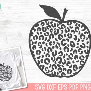 May include: Black and white leopard print apple silhouette.  The apple is a common symbol for teachers and education.