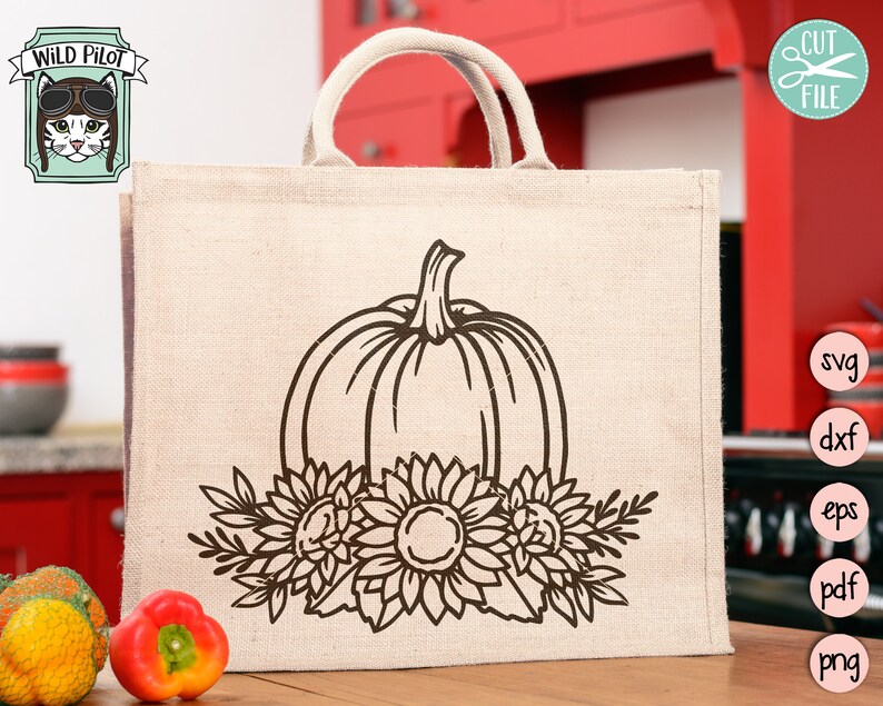 May include: A brown burlap tote bag with a black outline of a pumpkin and sunflowers. The text "Wild Pilot" is in the top left corner of the image.
