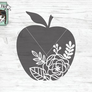May include: A dark gray apple silhouette with a floral design on the lower right. The design includes a rose, leaves, and other floral elements. The image also includes the text "SVG, DXF, EPS, PDF, PNG". A logo with a cat wearing goggles is in the upper left.