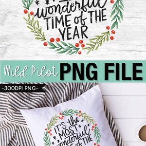 May include: White pillow with a Christmas wreath design and the text "It's the MOST wonderful TIME OF THE YEAR". The wreath features green leaves, red berries, and black lettering. The image also includes the text "PNG FILE".