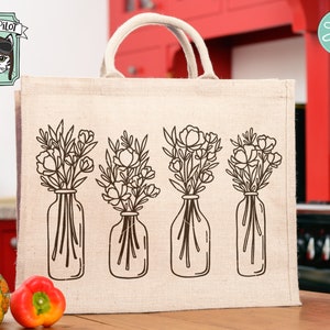 May include: A burlap tote bag with a design of four bouquets of flowers in glass vases. The flowers are in a simple line drawing style.