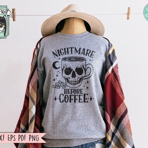 May include: Gray sweatshirt with a black skull and coffee cup graphic. The text reads "Nightmare Before Coffee".