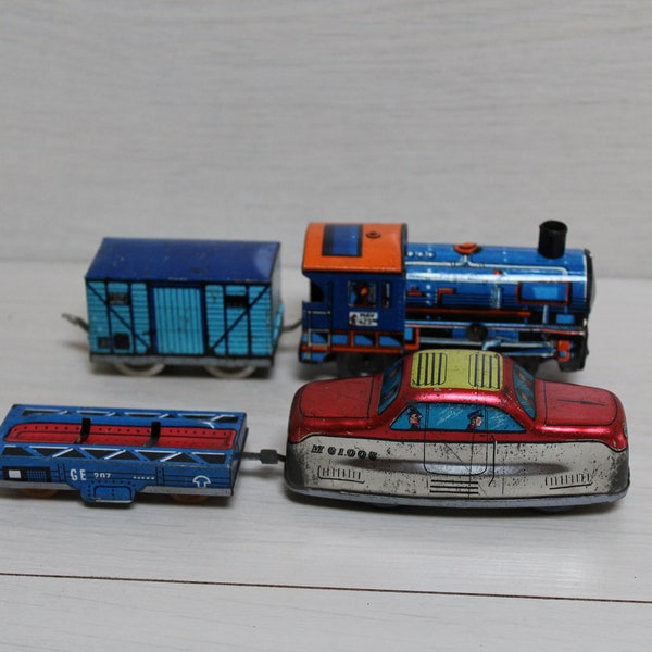 Set of metal locomotives and wagons. Trains. Mechanized old toys.