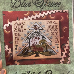 Grille de point de croix en épicéa bleu par Kathy Barrick
