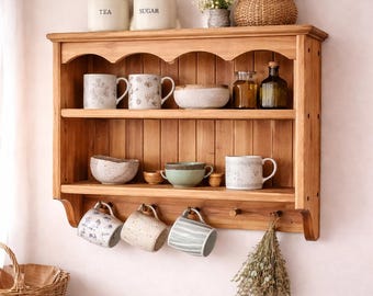 s92 Solid timber cottage style cabinet with wavy top moulding and pegs
