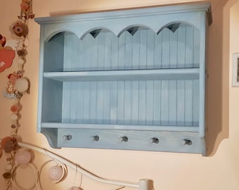s92 Solid timber cottage style cabinet with wavy top moulding and pegs