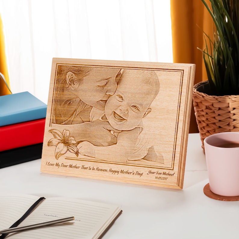 photo frame for mother and baby, made out of wood.