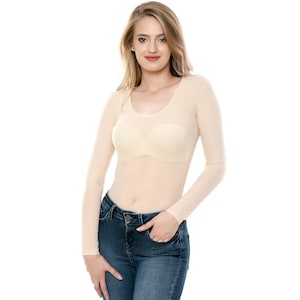 May include: A sheer, nude-colored long-sleeved top with a scoop neck. The top is made of a lightweight, breathable fabric and is perfect for layering.