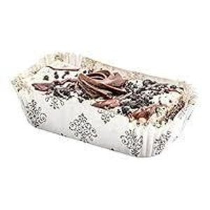 May include: A rectangular pastry in a decorative paper container. The pastry has a white base, topped with dark chocolate shavings, a swirl of chocolate, and other dark toppings. The paper container has a white background with a black floral pattern.