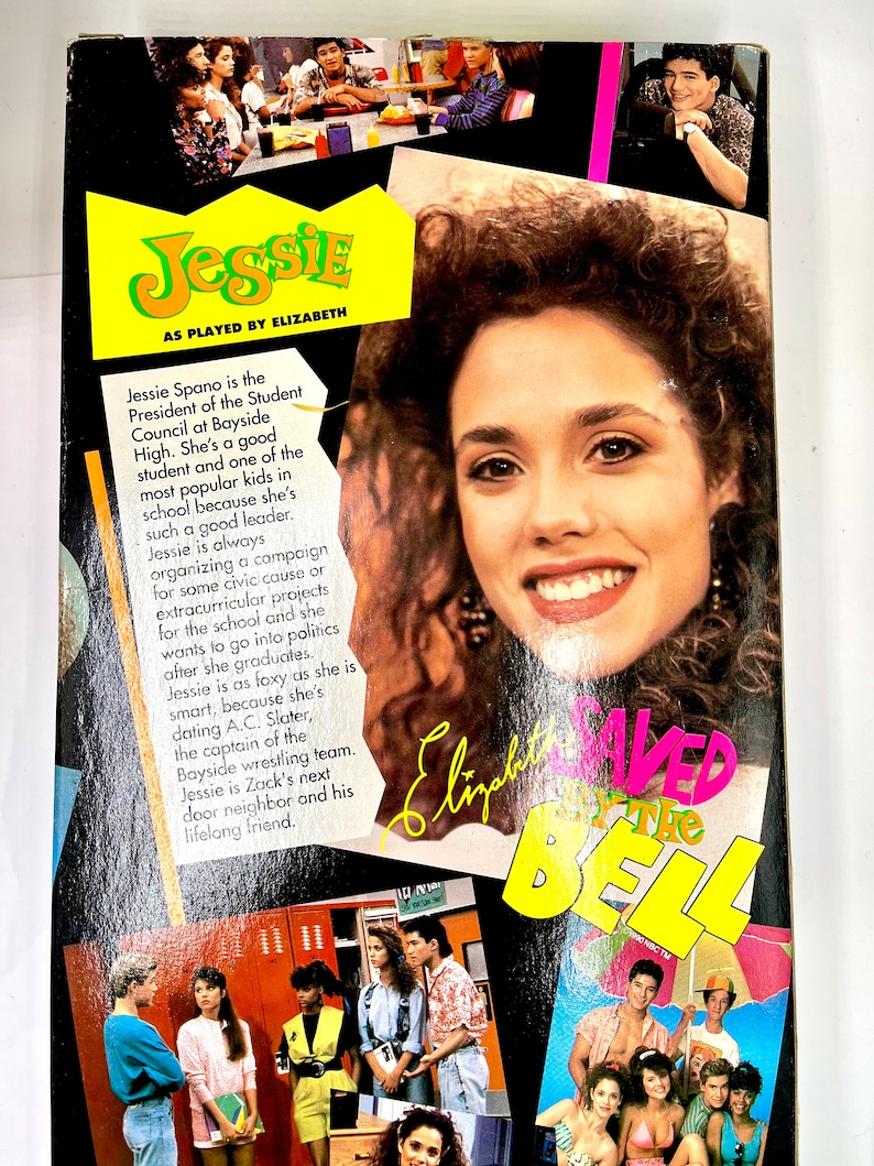 May include: A yellow and black box with a photo of a young woman with brown hair and a bright smile. The text "Jessie" is in large yellow letters on the box. The text "As played by Elizabeth" is below the name. The text "Saved by the Bell" is in yellow and pink letters on the box. The box is for a collectible doll or action figure.