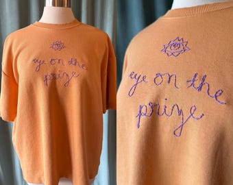Hand Embroidered “Eye on the Prize” Short Sleeve Tangerine Sweatshirt