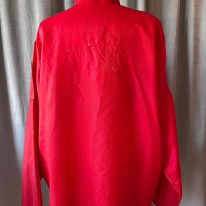 May include: A distressed wooden sign with the words "Welcome to our home" in white lettering. The sign has a rustic finish and a simple design, ideal for a hallway or porch.