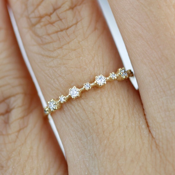 Wedding band with sale spaced out diamonds