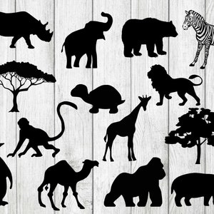 Op de afbeelding: Een verzameling zwarte dierensilhouetten, waaronder een neushoorn, olifant, beer, zebra, leeuw, giraffe, aap, pinguïn, kameel, gorilla en nijlpaard. Bevat ook twee boom silhouetten en een schildpad.