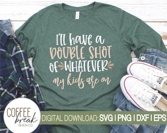 May include: A dark green long-sleeve t-shirt featuring the white and light pink text I'll have a double shot of whatever my kids are on. The shirt is displayed alongside a blue plaid flannel shirt, blue jeans, and white sneakers.