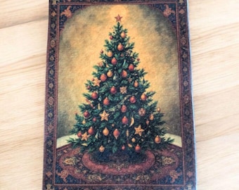 May include: A rectangular Christmas-themed decorative item featuring a detailed illustration of a decorated Christmas tree. The tree is adorned with ornaments and stars, set against a warm, golden background. The item has a decorative border.