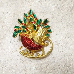 Vintage kerstslee-broche: goudkleurige kerstspeld