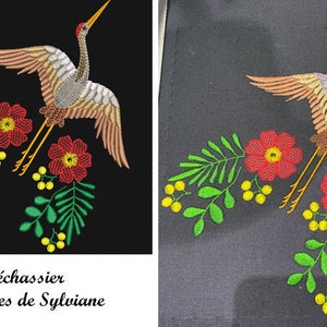 May include: Embroidered design of a crane flying over green leaves and red flowers. The text "L'échassier Broideries de Sylviane" is at the bottom of the image.
