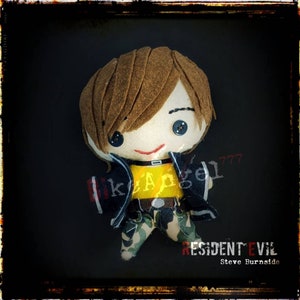 May include: A plush toy of a character with brown hair, wearing a black jacket, yellow shirt, and camouflage pants. The toy is holding a gun and has the text "RESIDENT EVIL Steve Burnside" on the bottom.