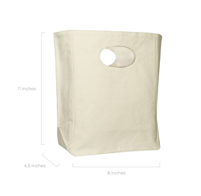 May include: A plain white canvas tote bag with a cut-out oval handle. The bag measures 11 inches tall, 8 inches wide, and 4.5 inches deep.