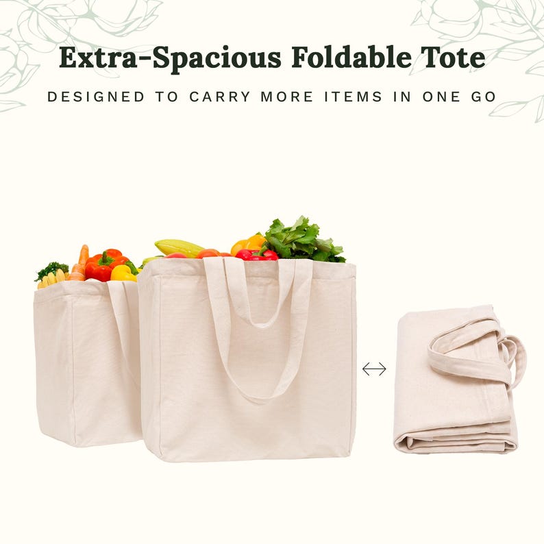 May include: Two off-white canvas tote bags, one filled with fresh produce including peppers and greens, and one folded flat. The text reads Extra-Spacious Foldable Tote, DESIGNED TO CARRY MORE ITEMS IN ONE GO. The bags feature two sturdy handles.
