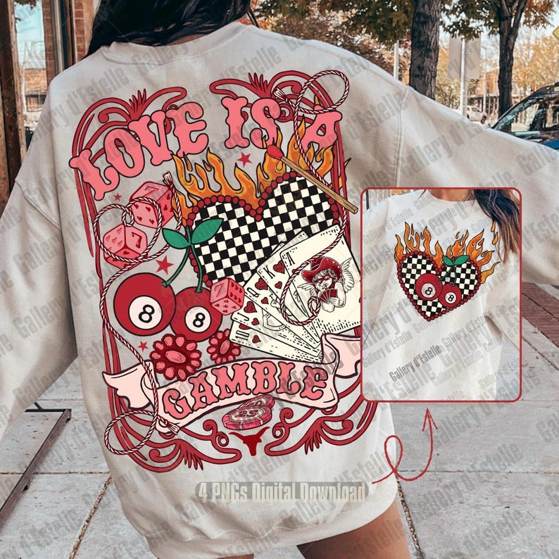 May include: A light beige sweatshirt with a large graphic design. The design features the text "LOVE IS A GAMBLE" with dice, cherries, playing cards, and a checkered heart. The design is in shades of red, pink, and black.