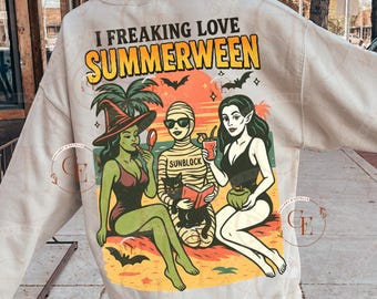 May include: Beige sweatshirt with a colorful graphic that reads "I Freaking Love Summerween." The graphic features three cartoon women in swimwear, palm trees, bats, and the text "2 PNG DIGITAL DOWNLOAD."